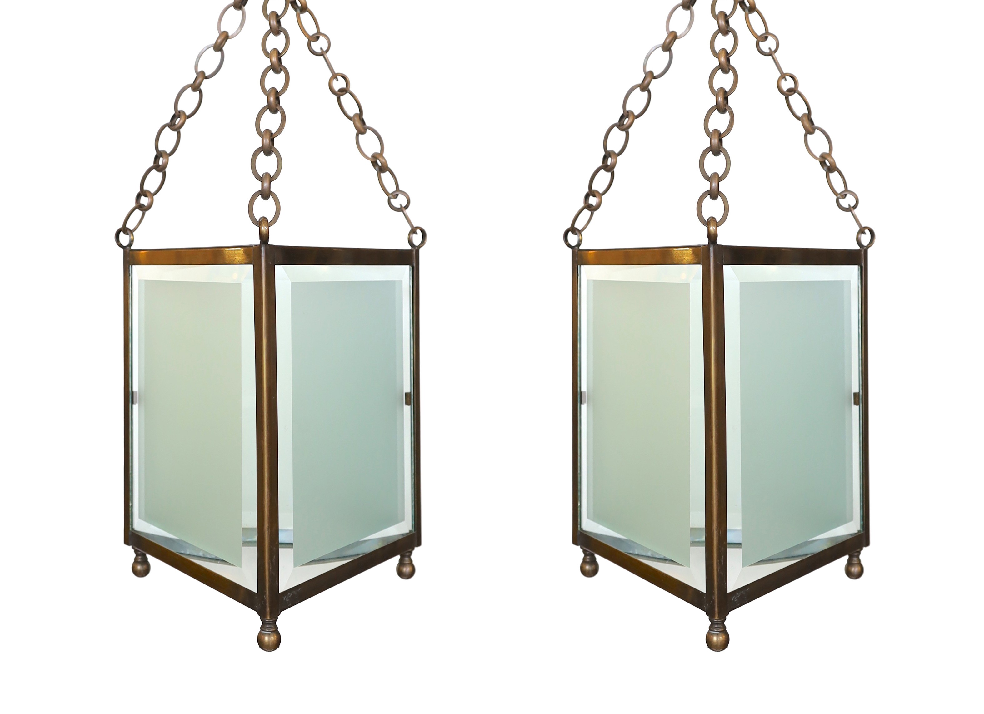 A pair of bronze and frosted glass triangular hall lanterns, height 36cm. width 33cm